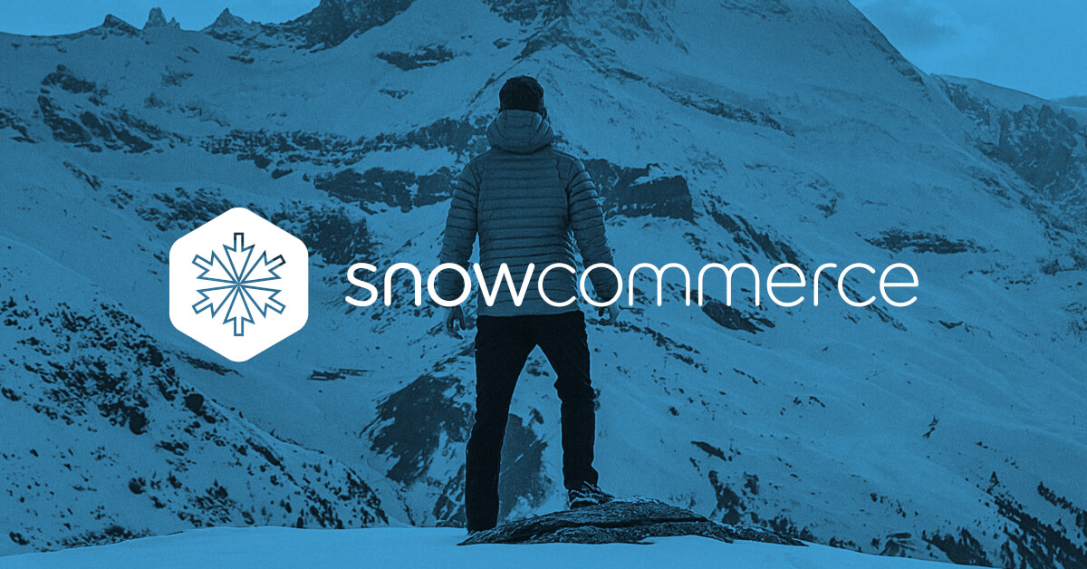 A man standing on top of a mountain representing Snow Commerce.